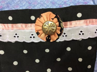 Here is a beautifully hand sewn yo-yo.